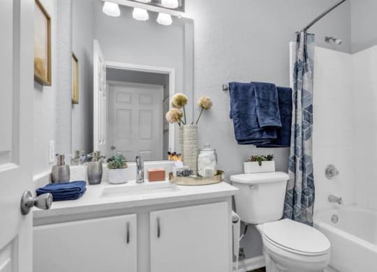 a white bathroom with a toilet sink and shower at Marina Point, Tennessee, 37415