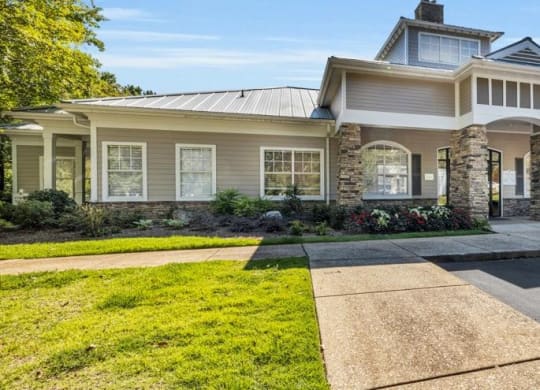 a house with a driveway and lawn in front of it at Marina Point, Tennessee, 37415