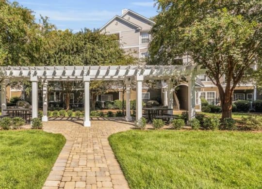 a pathway leading to a house with a pergola at Marina Point, Chattanooga, 37415