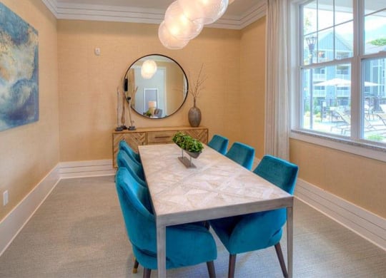 a dining room with a table and chairs and a mirror  at Lullwater at Big Ridge, Hixson, TN