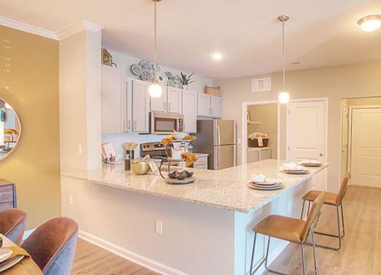 a kitchen with a counter top and a table  at Lullwater at Big Ridge, Hixson, TN, 37343
