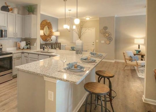 a kitchen with a marble counter top  at Lullwater at Big Ridge, Hixson, TN, 37343