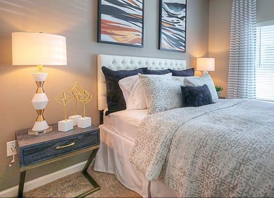 a bedroom with a bed and two lamps  at Lullwater at Big Ridge, Hixson, Tennessee