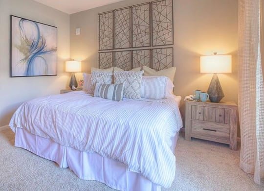 a bedroom with a large white bed  at Lullwater at Big Ridge, Hixson, TN