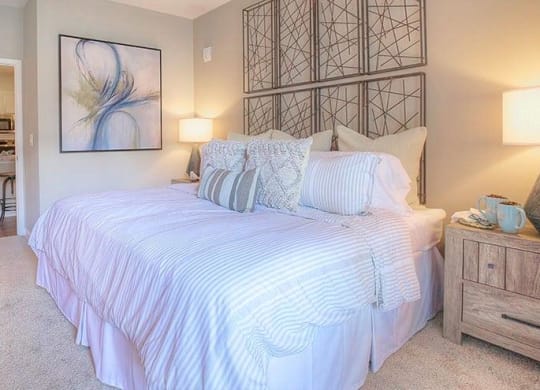 a bedroom with a bed and a bathroom  at Lullwater at Big Ridge, Hixson, Tennessee