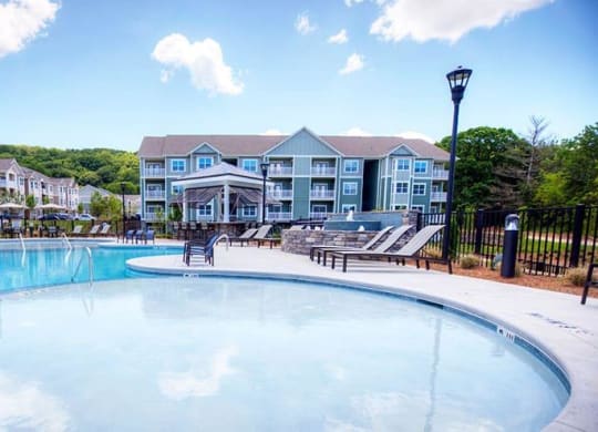 a large swimming pool with a building in the background  at Lullwater at Big Ridge, Hixson, TN, 37343