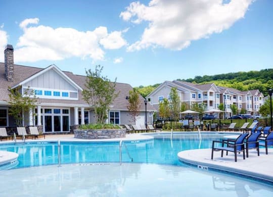 a large swimming pool with chairs in front of a building  at Lullwater at Big Ridge, Tennessee, 37343