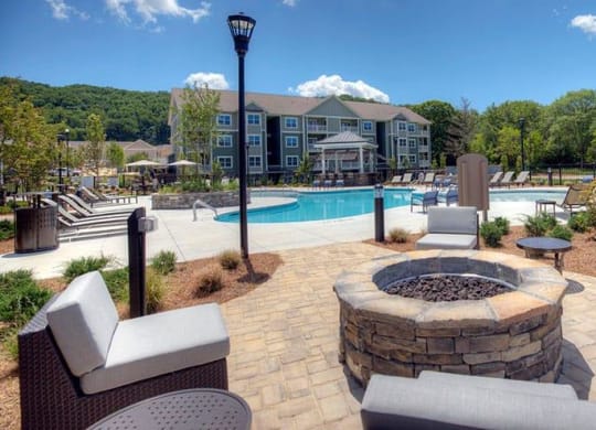 an outdoor patio with a fire pit and a swimming pool  at Lullwater at Big Ridge, Tennessee, 37343