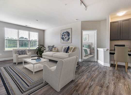 A living room with a white couch and a coffee table.