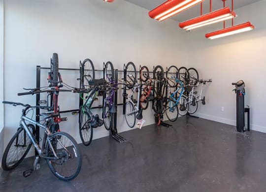 a room filled with lots of bikes on top of a cement floor at Livingston Flats Apartments, Chesterfield, VA, 23832