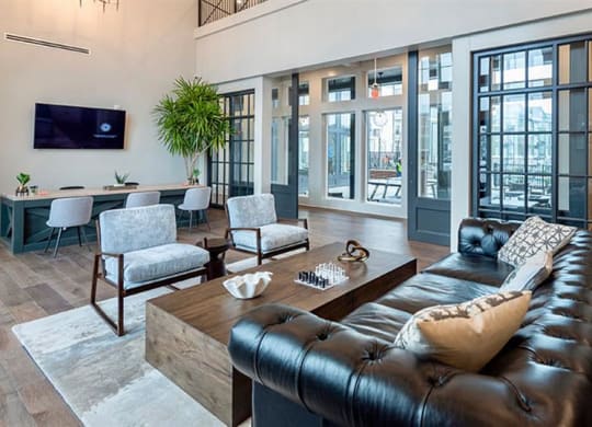 a living room filled with furniture and a flat screen tv at Livingston Flats Apartments, Chesterfield, VA