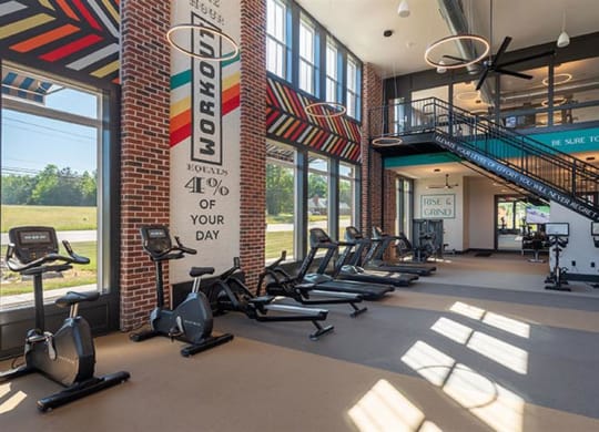 a gym with treadmills and other exercise equipment at  Livingston Flats Apartments, Virginia