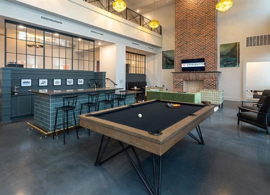 a pool table is in the middle of a room at Livingston Flats Apartments, Chesterfield, VA