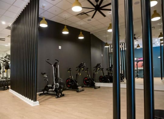 a room filled with lots of different types of exercise equipment at Flats at West Broad Village, Glen Allen Virginia
