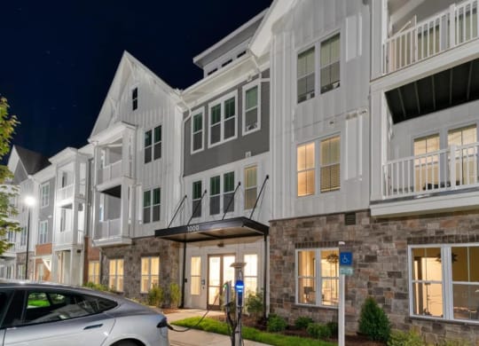 a car parked in front of a building at Artistry at Winterfield Apartments, Midlothian