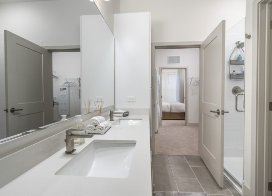 a bathroom with a sink and a shower at Artistry at Winterfield Apartments, Virginia