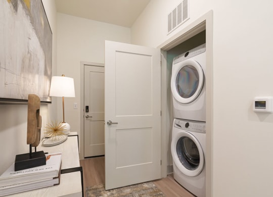 a front load washer and dryer in a laundry room at Artistry at Winterfield Apartments, Midlothian, VA, 23112