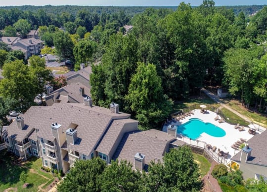 an aerial view of a house with a pool in the backyard at Hunters Chase Apartments, Midlothian, VA