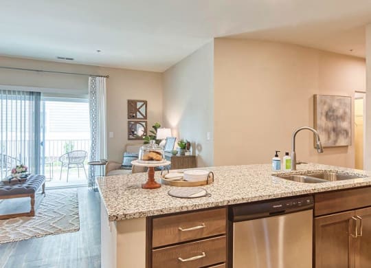a kitchen with a sink and a dishwasher  at Sapphire at Centerpointe, Midlothian, VA, 23114