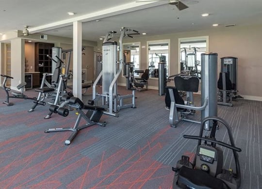 Fitness center with on demand workouts at 2000 West Creek Apartments, Virginia, 23238