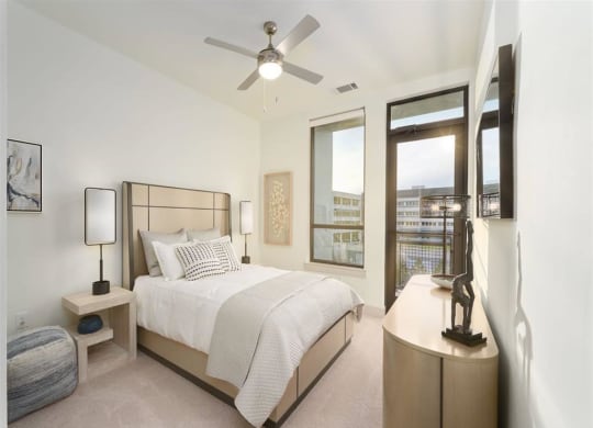 a bedroom with a bed and a ceiling fan at Tapestry West, Virginia