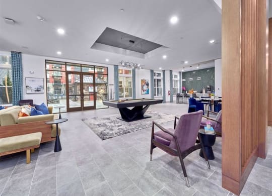 a room with a ping pong table and couches at Tapestry West, Richmond, 23230