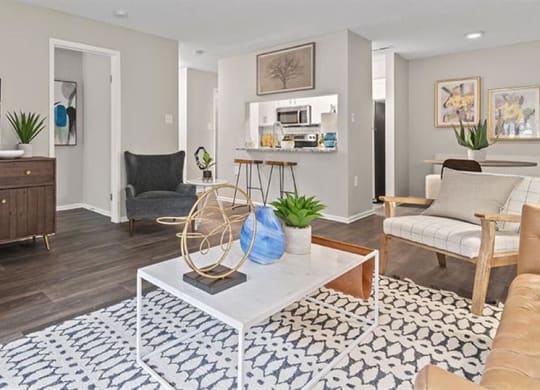 a living room filled with furniture and a flat screen tv at Trails at Short Pump Apartments, Richmond, VA, 23233