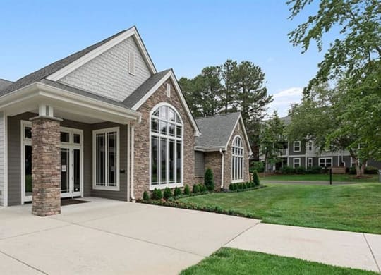 a house with a driveway and lawn at Trails at Short Pump Apartments, Richmond ,23233