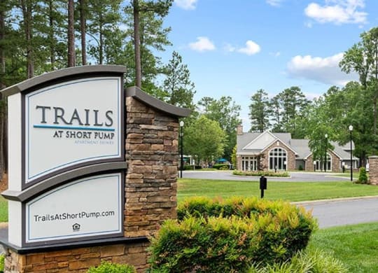 a sign that says trails at short trail in front of a house at Trails at Short Pump Apartments, Virginia