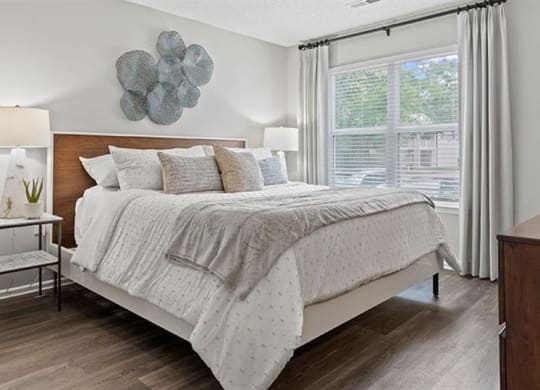 a bedroom with a bed and a window at Trails at Short Pump Apartments, Richmond, Virginia
