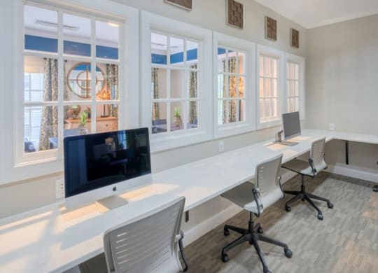 a long white table with two computers on top of it at Sterling Manor, Williamsburg, VA 23185