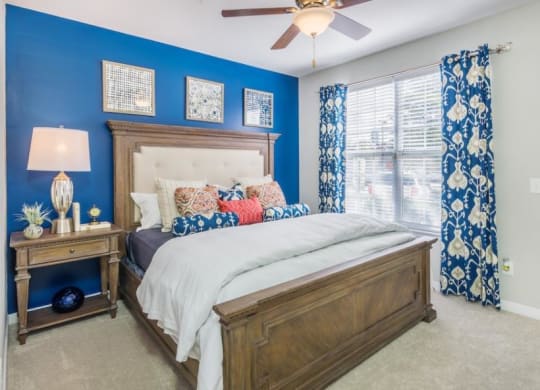 a bedroom with a bed and a ceiling fan at Sterling Manor, Virginia