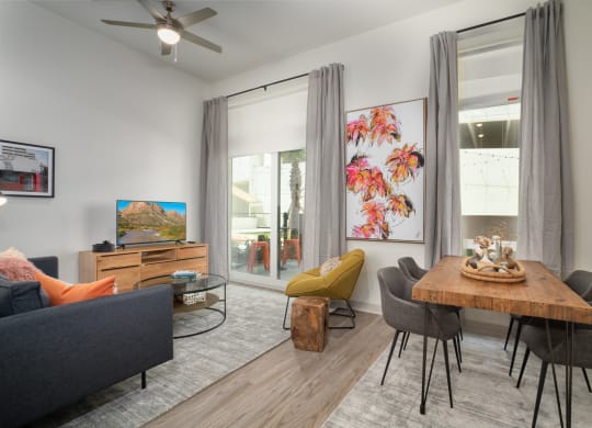 an open living room and dining room with a table and chairs at Vista Brooklynn Apartments, Florida, 32202