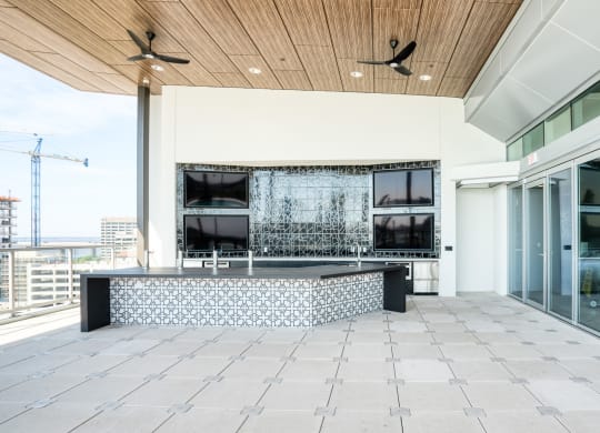 a terrace with a pool and glass sliding doors at Vista Brooklynn Apartments, Florida, 32202