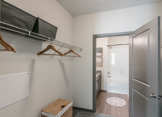 a walk in closet with a door to the bathroom and a closet door to a at Village at Westland Cove Apartments, Knoxville, TN