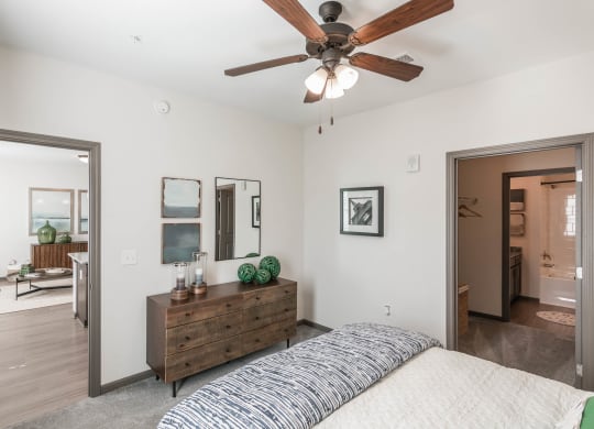 a bedroom with a bed and a ceiling fan at Village at Westland Cove Apartments, Tennessee, 37922