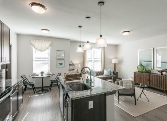 an open kitchen and living room with a table and chairs at Village at Westland Cove Apartments, Knoxville, TN, 37922