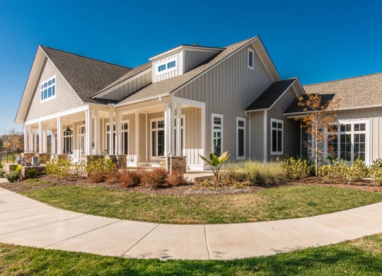 a large house with a sidewalk in front of it at Village at Westland Cove Apartments, Knoxville, TN, 37922