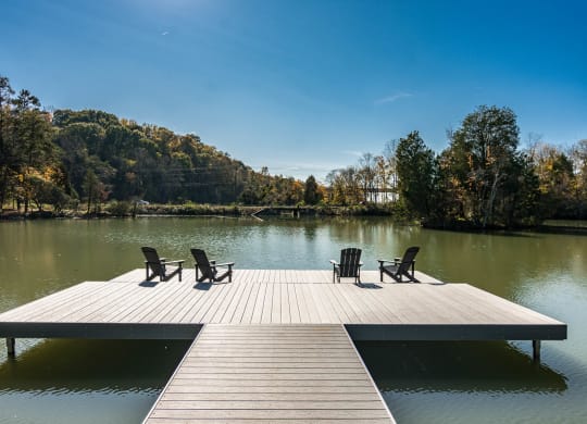 a dock at a lake with chairs on it at Village at Westland Cove Apartments, Knoxville