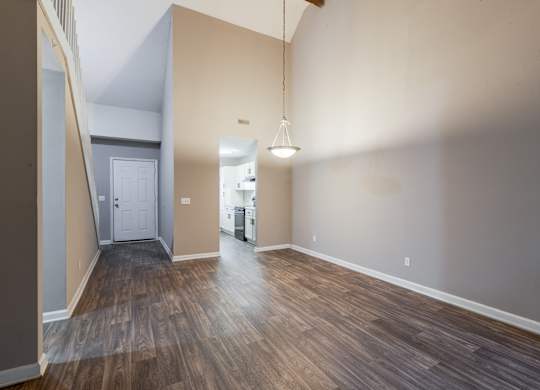 A room with wooden floors and a white door.