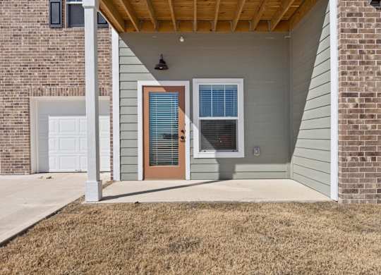A house with a brown door and a brown window.