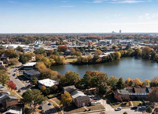 A small town with a large lake in the middle of it.