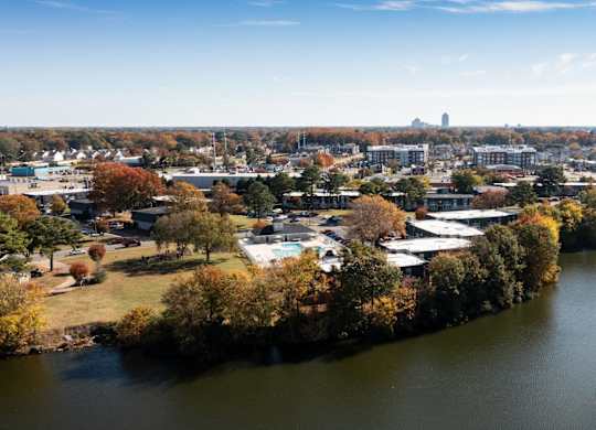 A river flows through a city with buildings on both sides.