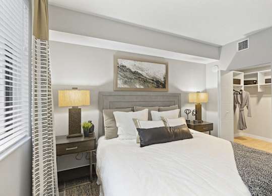 a bedroom with a bed and a closet at Mayla Pompano, Pompano Beach, Florida