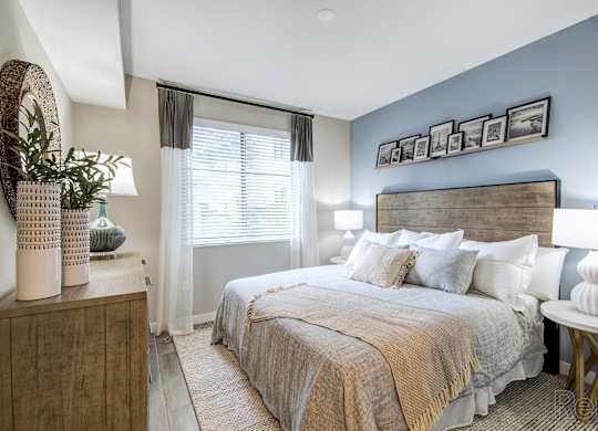 A bedroom with a large bed and a wooden headboard at Mayla Pompano, Pompano Beach, Florida