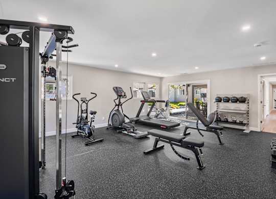 A well-equipped gym with a variety of exercise machines.