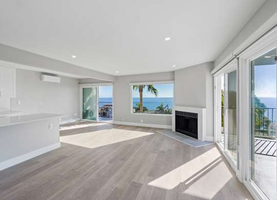 A spacious living room with a fireplace at Ocean Edge @ Laguna Beach, Laguna Beach, 92651