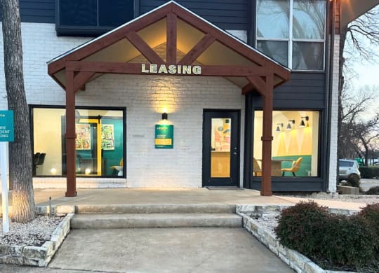 the front of a leasing office in a building