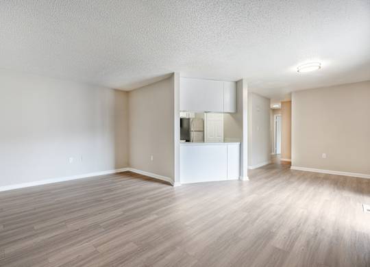 A room with a white cabinet and a white wall.