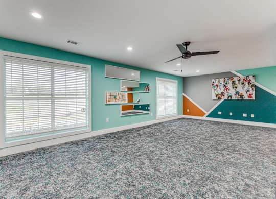 A room with a ceiling fan and a window with blinds. at Carisma, Dallas